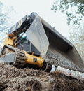Skid steer operation in grading project in Marshville, North Carolina.